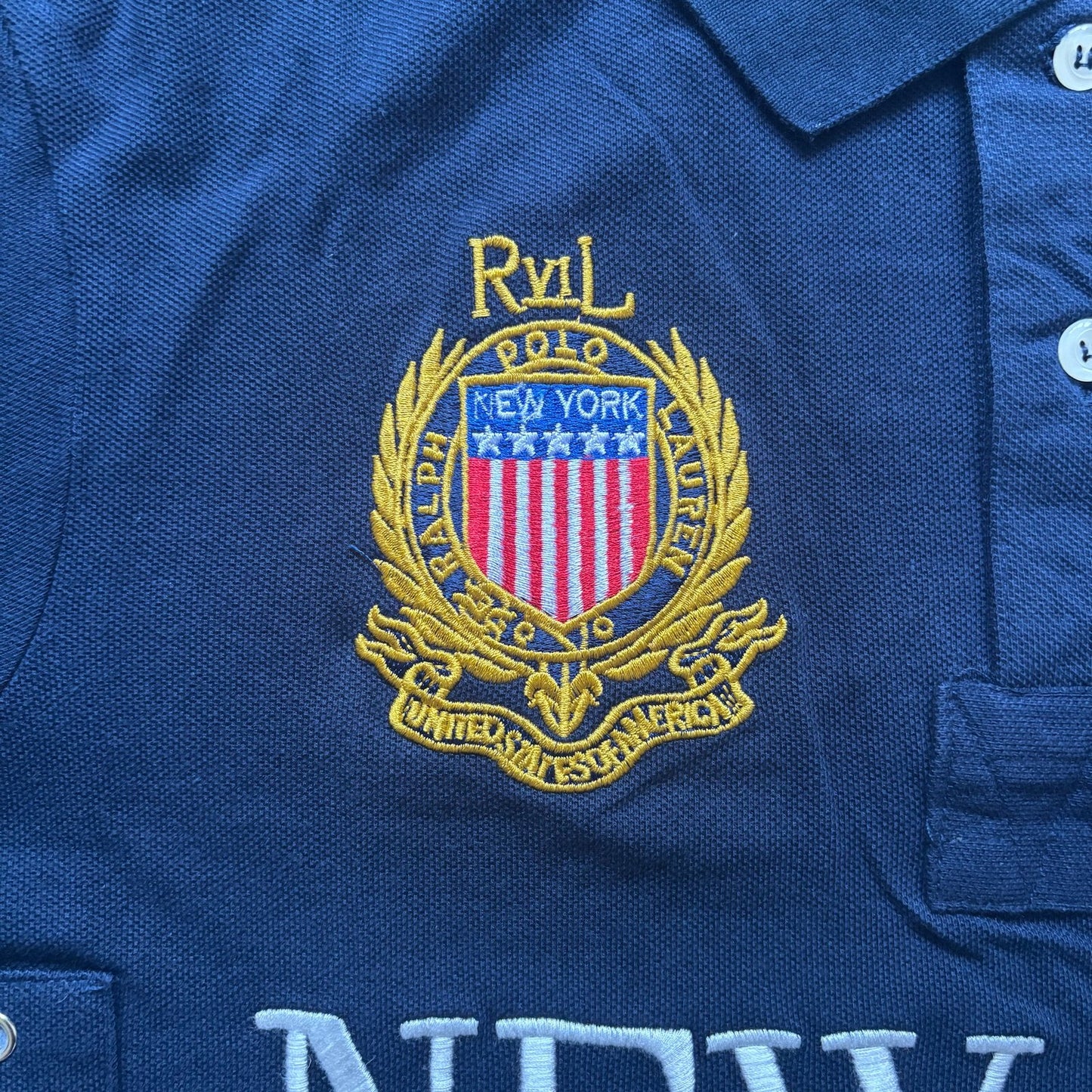 Texture detail of cotton fabric – New York dark blue polo for men
