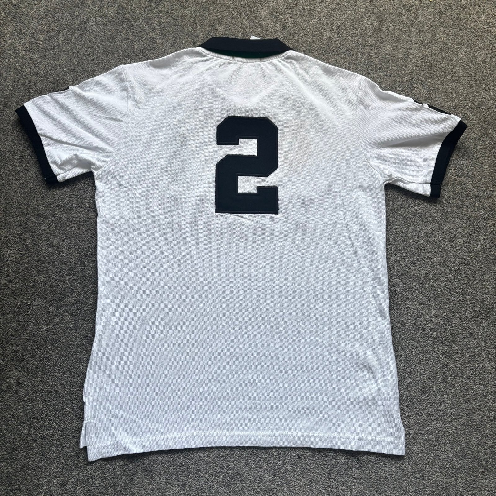 Back design of men's white polo – Dubai collection