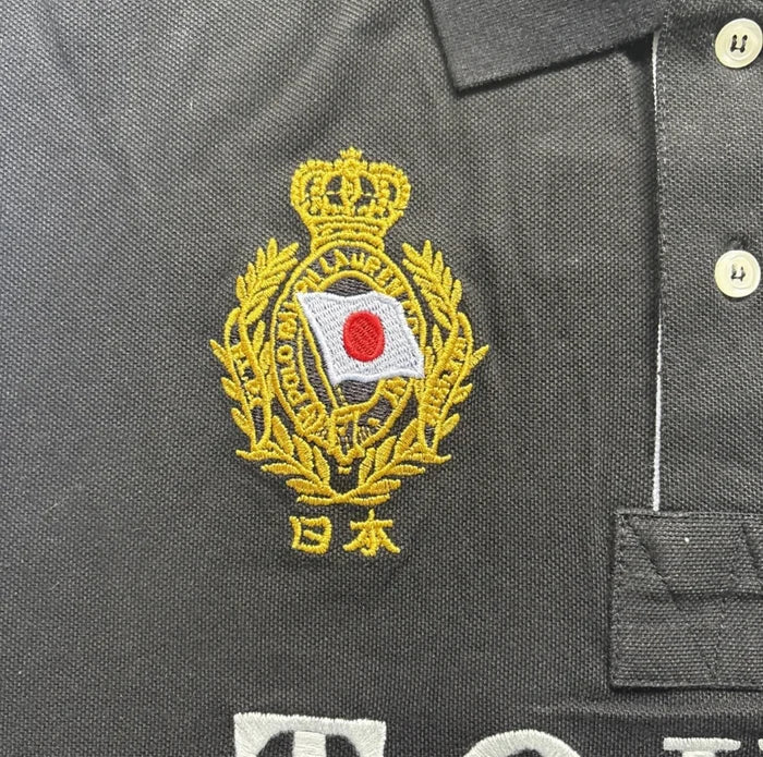Detailed close-up of black cotton – Tokyo modern men's polo shirt

